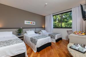 Cama ou camas em um quarto em Viale Cataratas Hotel & Eventos