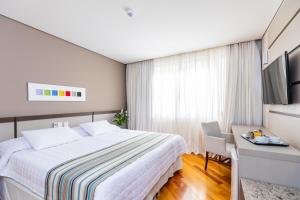 Cama ou camas em um quarto em Viale Cataratas Hotel & Eventos