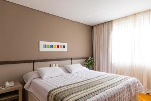 Cama ou camas em um quarto em Viale Cataratas Hotel & Eventos