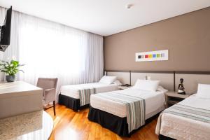 Cama ou camas em um quarto em Viale Cataratas Hotel & Eventos