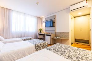 Cama ou camas em um quarto em Viale Cataratas Hotel & Eventos