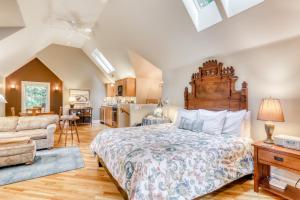 a bedroom with a large bed and a living room at Serene Redwood Retreat in Arcata