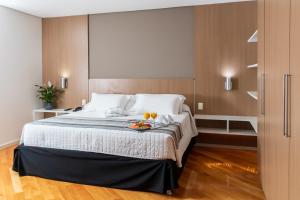 Cama ou camas em um quarto em Viale Cataratas Hotel & Eventos