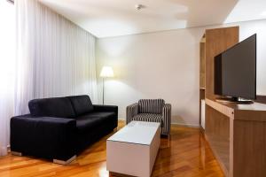 Uma TV ou centro de entretenimento em Viale Cataratas Hotel & Eventos