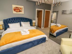 Ένα ή περισσότερα κρεβάτια σε δωμάτιο στο Ellie's Lodge