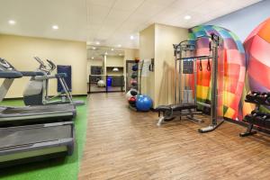 a fitness room with treadmills and exercise equipment at Hotel Indigo Cleveland Beachwood, an IHG Hotel in Beachwood