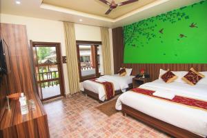 Katil atau katil-katil dalam bilik di Jungle Safari Lodge- Serenity in the Wild