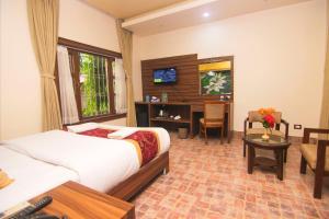 Katil atau katil-katil dalam bilik di Jungle Safari Lodge- Serenity in the Wild