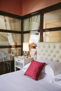 Кровать или кровати в номере Albergo Terminus