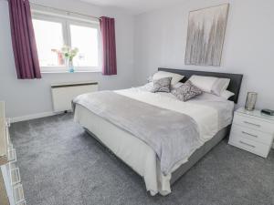 En eller flere senge i et værelse på Cumbrae View