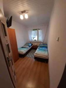 Postel nebo postele na pokoji v ubytování NEMO + 1 fotografie