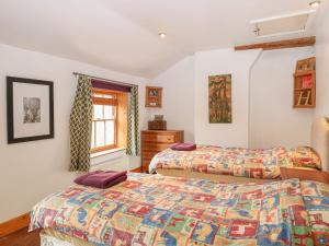 Postel nebo postele na pokoji v ubytování 3 Station Cottages