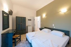 Posteľ alebo postele v izbe v ubytovaní Angeliki Seaside Hotel