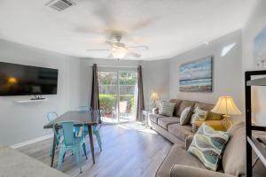 a living room with a couch and a table at Gulf View II in Destin