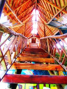 
a wooden structure with a wooden roof and a wooden ceiling at Se Ua in Manzanillo
