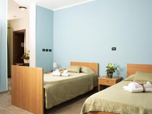La Locanda del Priore tesisinde bir odada yatak veya yataklar