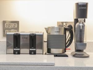 a kitchen counter with a coffeemaker and a coffee maker at Idlewild, 2 Wheal Turnavore in St. Agnes 