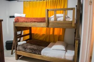 Postel nebo postele na pokoji v ubytování Ulucaho Hostel