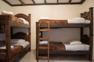 Postel nebo postele na pokoji v ubytování Ulucaho Hostel