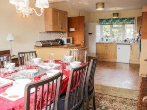 a kitchen and dining room with a table and chairs at Lane House in Bishops Castle