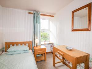 Postel nebo postele na pokoji v ubytování Stable Cottage