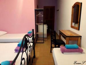 A bed or beds in a room at EVANS Skiathos