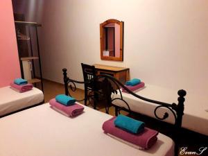 A bed or beds in a room at EVANS Skiathos