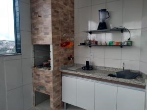 Kuhinja oz. manjša kuhinja v nastanitvi Apto 3 quartos com espaço gourmet e vista Panorâmica