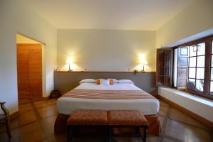 a bedroom with a large bed in a room at Casa Hacienda San Jose in Chincha Alta