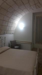 Postel nebo postele na pokoji v ubytování Palazzo Mellacqua