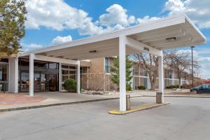a large white building with a parking lot at Quality Inn & Suites Canon City in Canon City