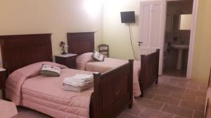 Postel nebo postele na pokoji v ubytování Palazzo Mellacqua