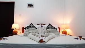 Postel nebo postele na pokoji v ubytování Dream Villa Sigiriya