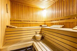 a wooden sauna with a trash can in it at Sofia Palace Hotel by HMG in Sofia