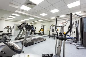 a gym with treadmills and cardio machines at Sofia Palace Hotel by HMG in Sofia
