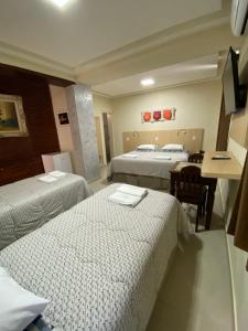 Postel nebo postele na pokoji v ubytování Palace Hotel