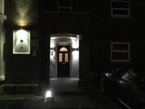 a dark hallway with a light at night at Bay Tree House in Dorchester