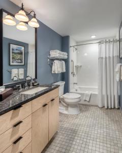 a bathroom with a sink and a toilet and a shower at WorldMark Portland Waterfront Park in Portland