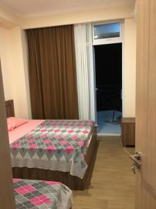 Postel nebo postele na pokoji v ubytování Kvariati apartamenrs