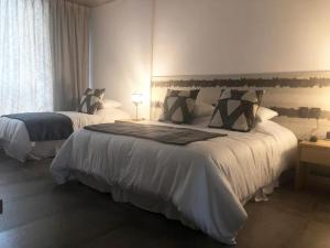 Ένα ή περισσότερα κρεβάτια σε δωμάτιο στο O2 Hotel Iguazu