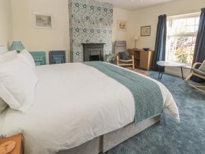 En eller flere senge i et værelse på Wordsworth Cottage West