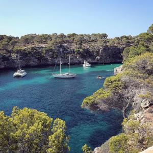 two boats are docked in a body of water at Finca Ses Eres in Artá
