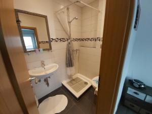 Koupelna v ubytování Appartment Vermietung Lütje