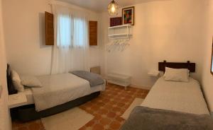 Een bed of bedden in een kamer bij Villa Loza Dorada