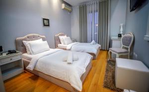 Ένα ή περισσότερα κρεβάτια σε δωμάτιο στο Univers Resort
