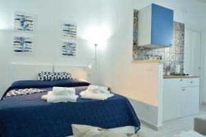 Postel nebo postele na pokoji v ubytování Scala dei Turchi Luxury Home + 37 fotografií