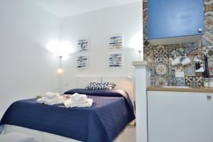 Postel nebo postele na pokoji v ubytování Scala dei Turchi Luxury Home