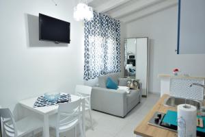 TV a/nebo společenská místnost v ubytování Scala dei Turchi Luxury Home