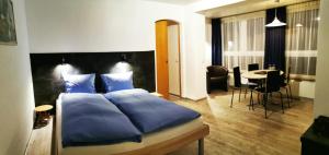 Lova arba lovos apgyvendinimo įstaigoje Hotel Alpha