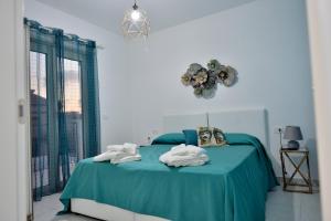 Postel nebo postele na pokoji v ubytování Scala dei Turchi Luxury Home